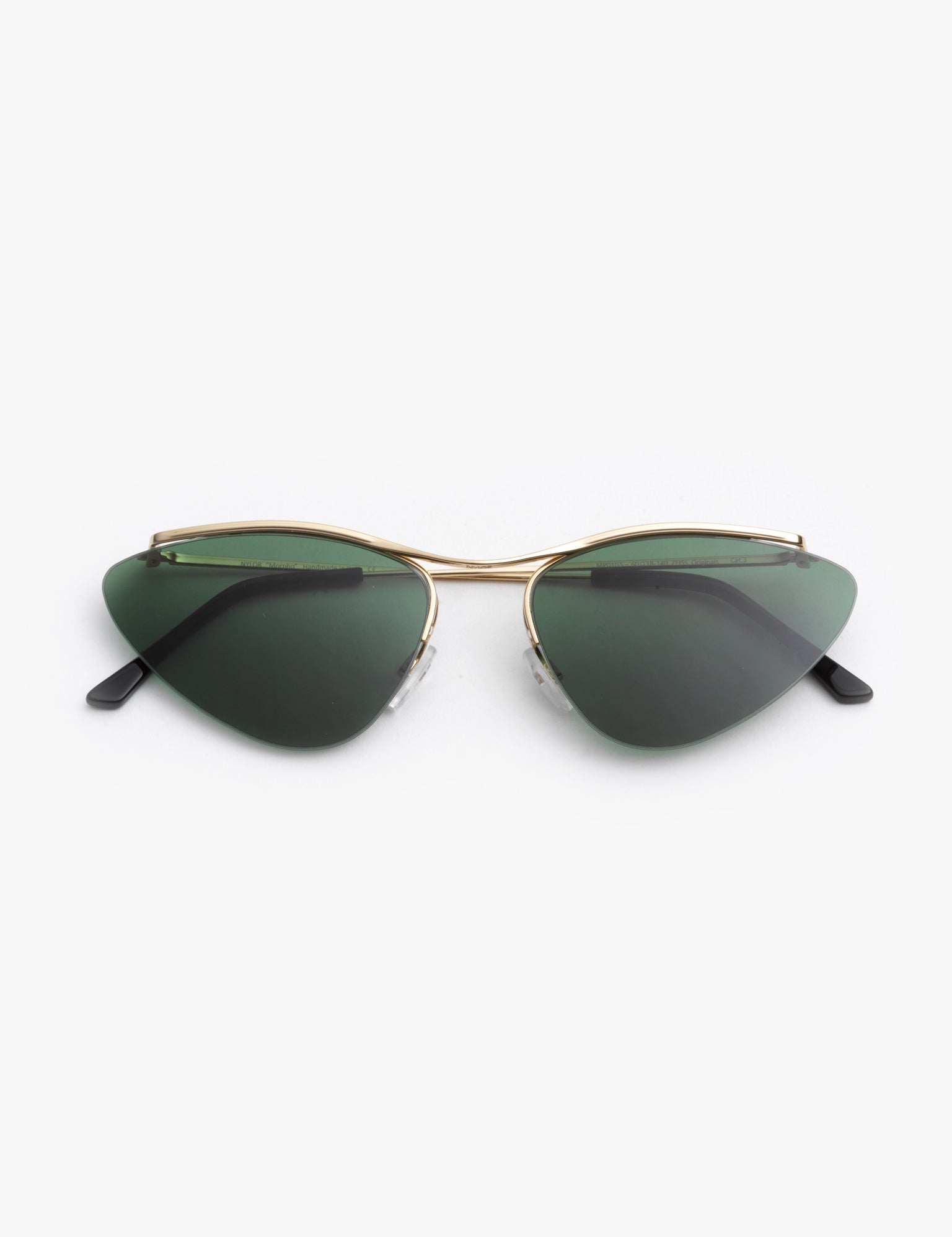 A pair of vintage green sunglasses with a pale gold metal alloy frame, featuring invisible nylon rims and adjustable nosepads.