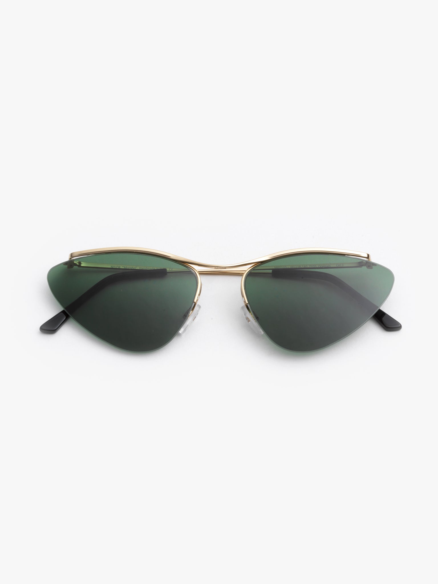 A pair of vintage green sunglasses with a pale gold metal alloy frame, featuring invisible nylon rims and adjustable nosepads.