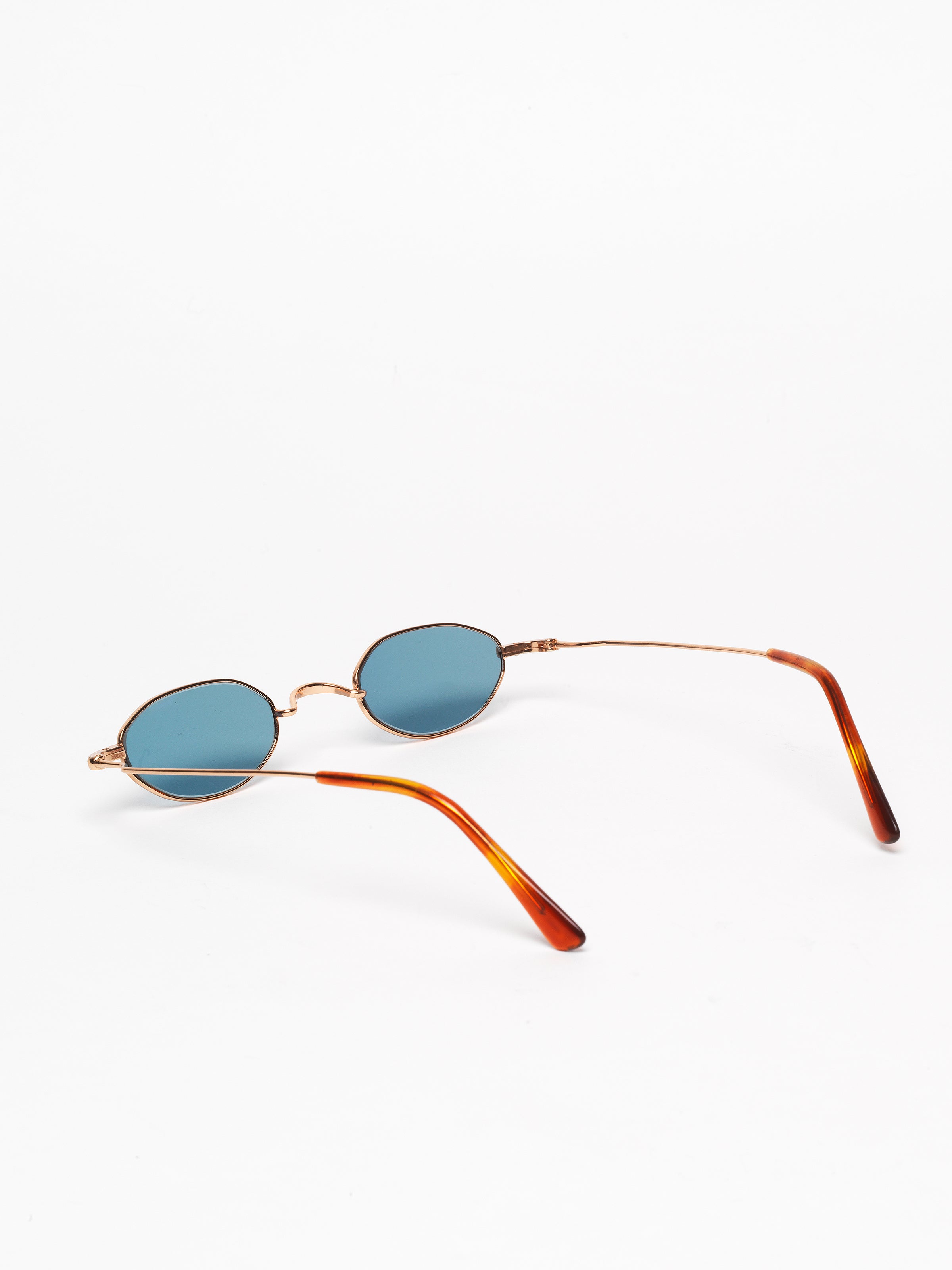 Gouverneur Audigier The Reimagined Tiny Oval Rose Gold with Azure Blue Lenses sunglasses, rear three-quarter view